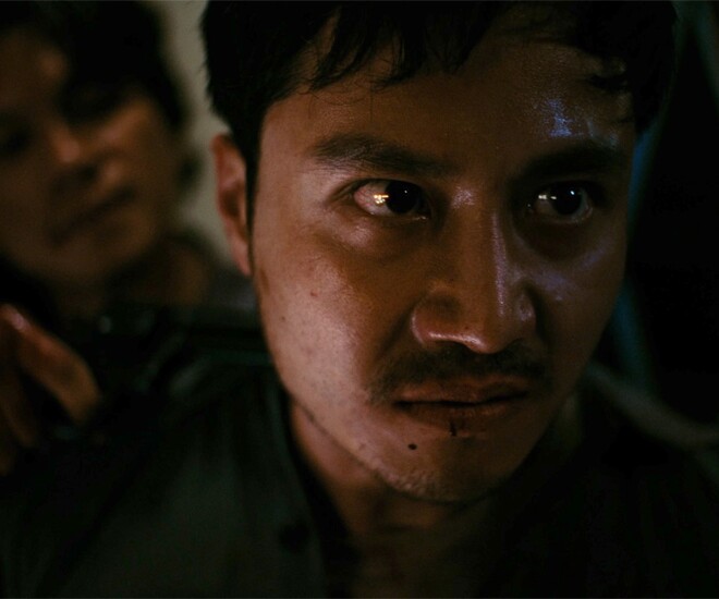 Thanh Sơn trong vai cảnh vệ Bình của phim Tử Chiến Trên Không.