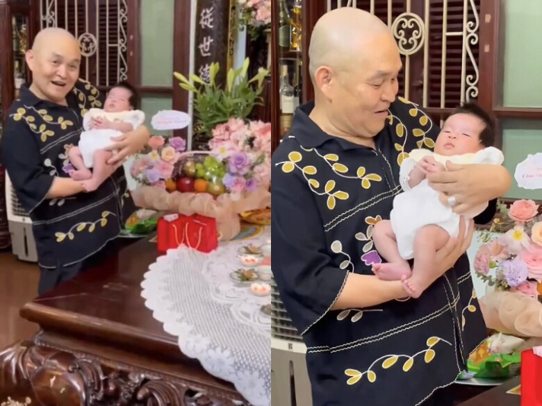 Xuân Hinh hạnh phúc bế bồng cháu ngoại.