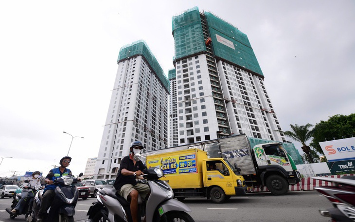 Bộ Xây dựng: Không để tiền sử dụng đất đẩy giá nhà tăng cao - Ảnh 3.