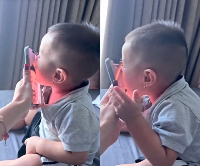 Bạn gái Quang Minh khoe cảnh con hôn tới tấp vào điện thoại khi bố đi làm xa, quý tử bé xíu đã sống tình cảm 1 Con trai Quang Minh hôn tới tấp vào màn hình điện thoại khi gọi video với bố.