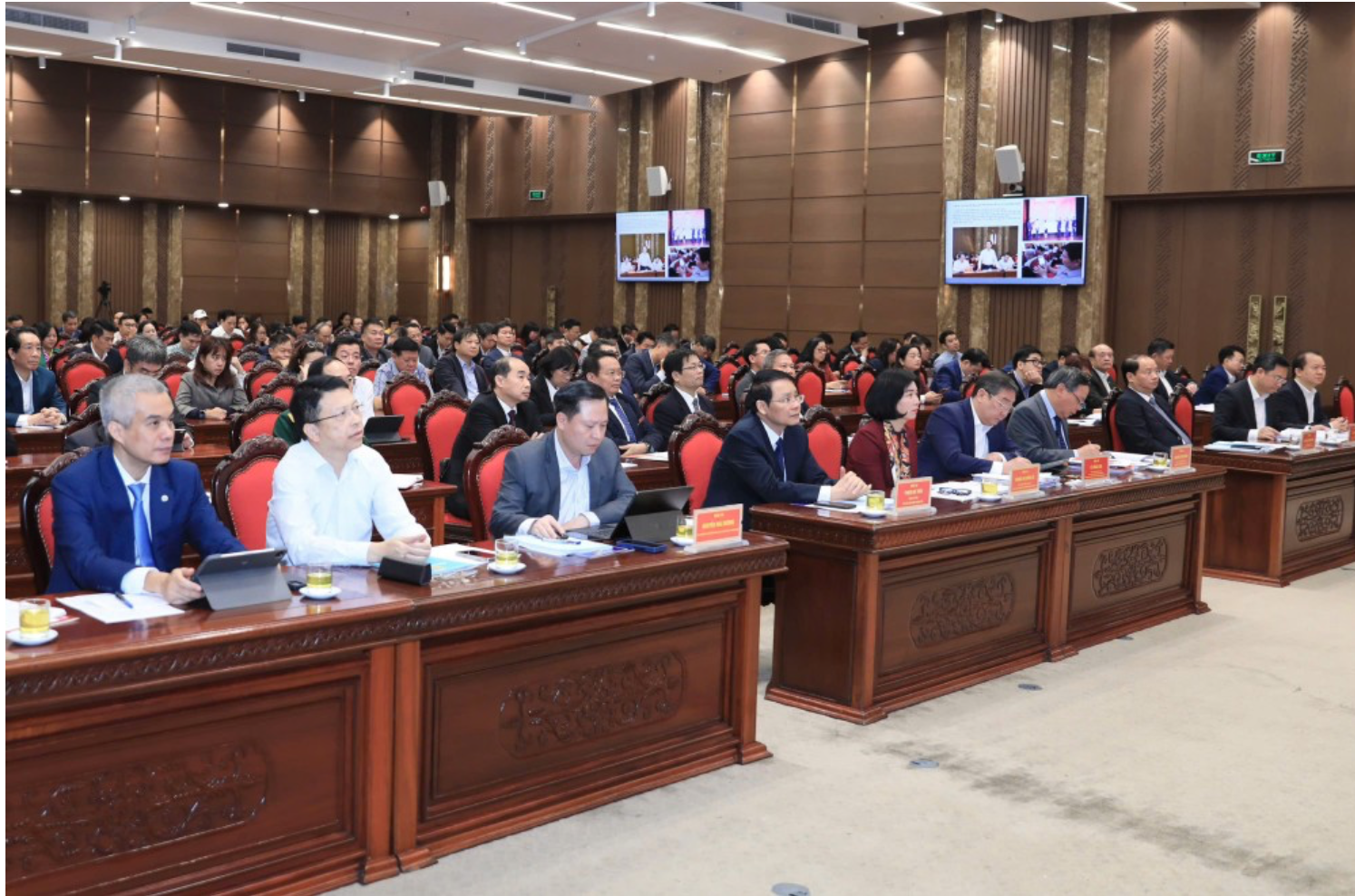 A group of people in a conference room  AI-generated content may be incorrect.