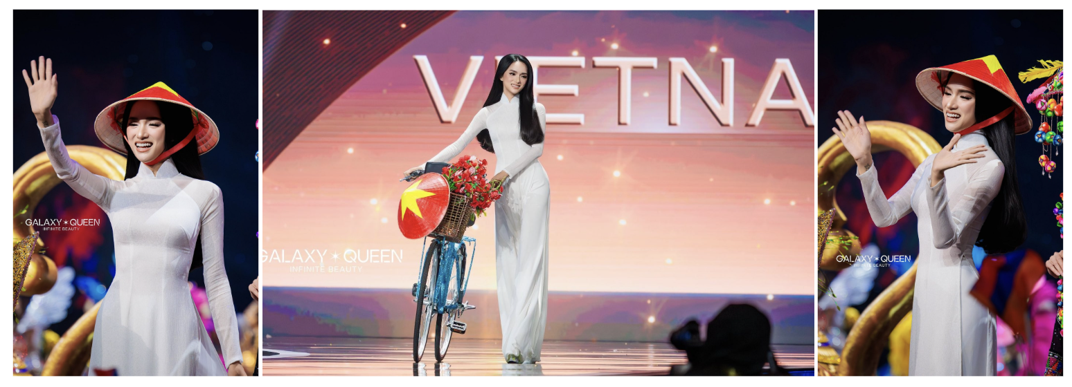 Hương Giang diện áo dài trắng lên sân khấu buổi trình diễn trang phục dân tộc.