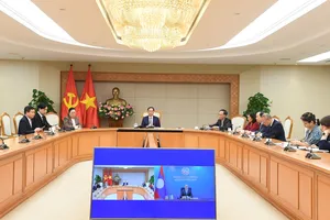 Việt Nam - Lào trao đổi về tình hình khu vực và quốc tế