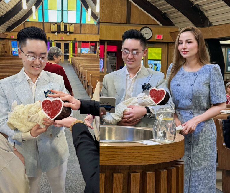 Bé Ong nằm ngoan trong vòng tay của bố mẹ.