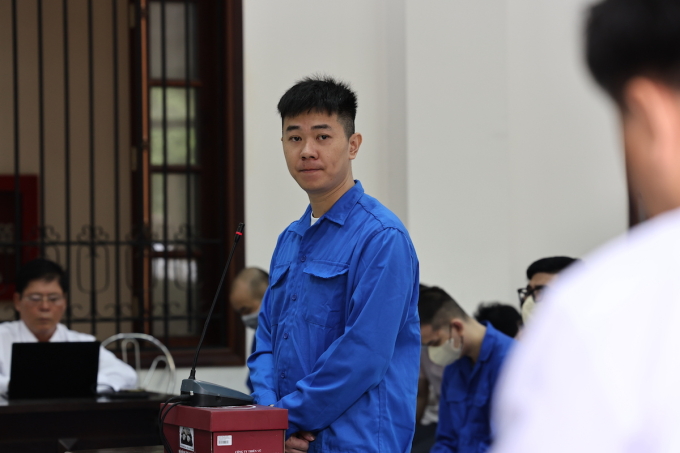 Tường trả lời câu hỏi của luật sư bào chữa sáng 18/7. Ảnh: Phước Tuấn