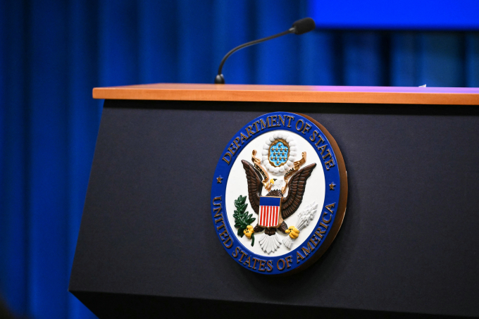 The seal of the US Department of State is seen on the lectern during an end-of-year press conference in the State Department Press Briefing Room in Washington, DC on December 19, 2025. AFP