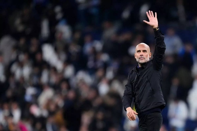 Guardiola mừng chiến thắng sau trận Real 1-2 Man City ở lượt sáu vòng bảng Champions League tối 10/12. Ảnh: AFP