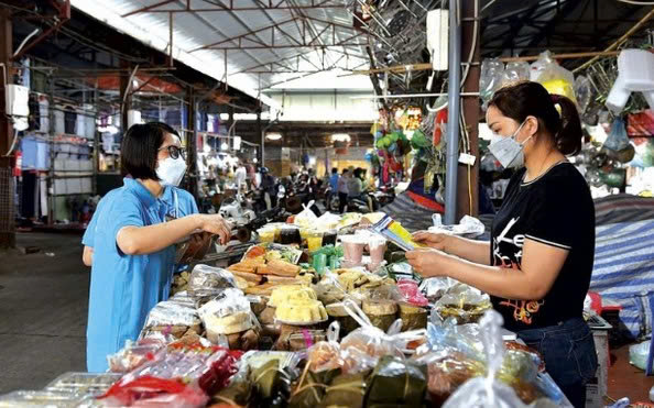 Doanh thu từ 500 triệu đến 3 tỉ đồng: Hộ kinh doanh nộp thuế ra sao? - Ảnh 1.