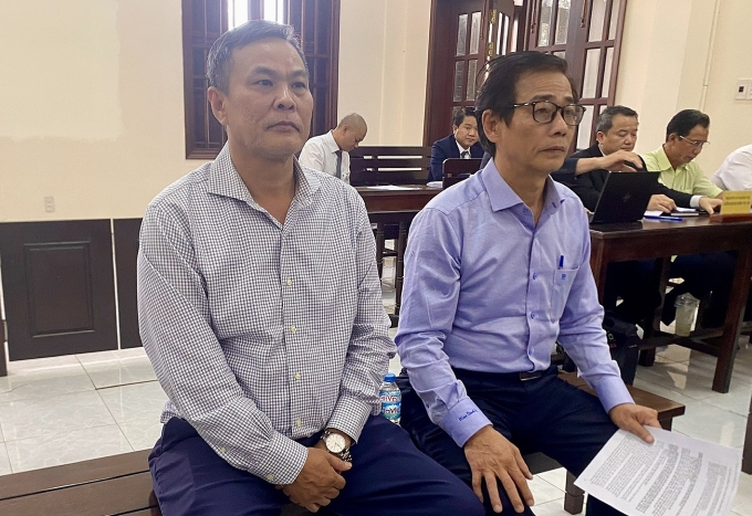 Bị cáo Nguyễn Huy Hùng và Nguyễn Quang Lộc tại tòa. Ảnh: Hải Duyên