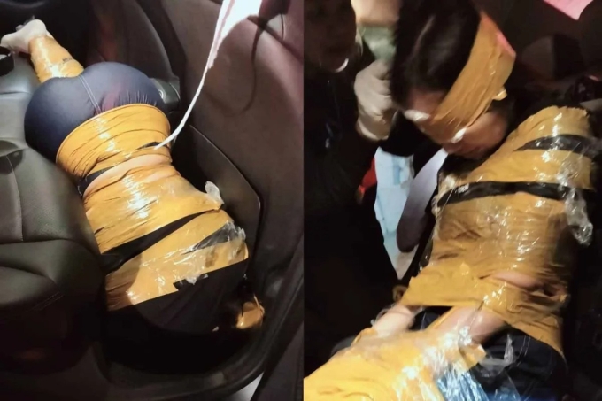 Nạn nhân Yang Wang được cảnh sát tìm thấy trong tình trạng bị trói khắp người bằng băng keo, nằm dưới sàn xe. Ảnh: Bangkok Post