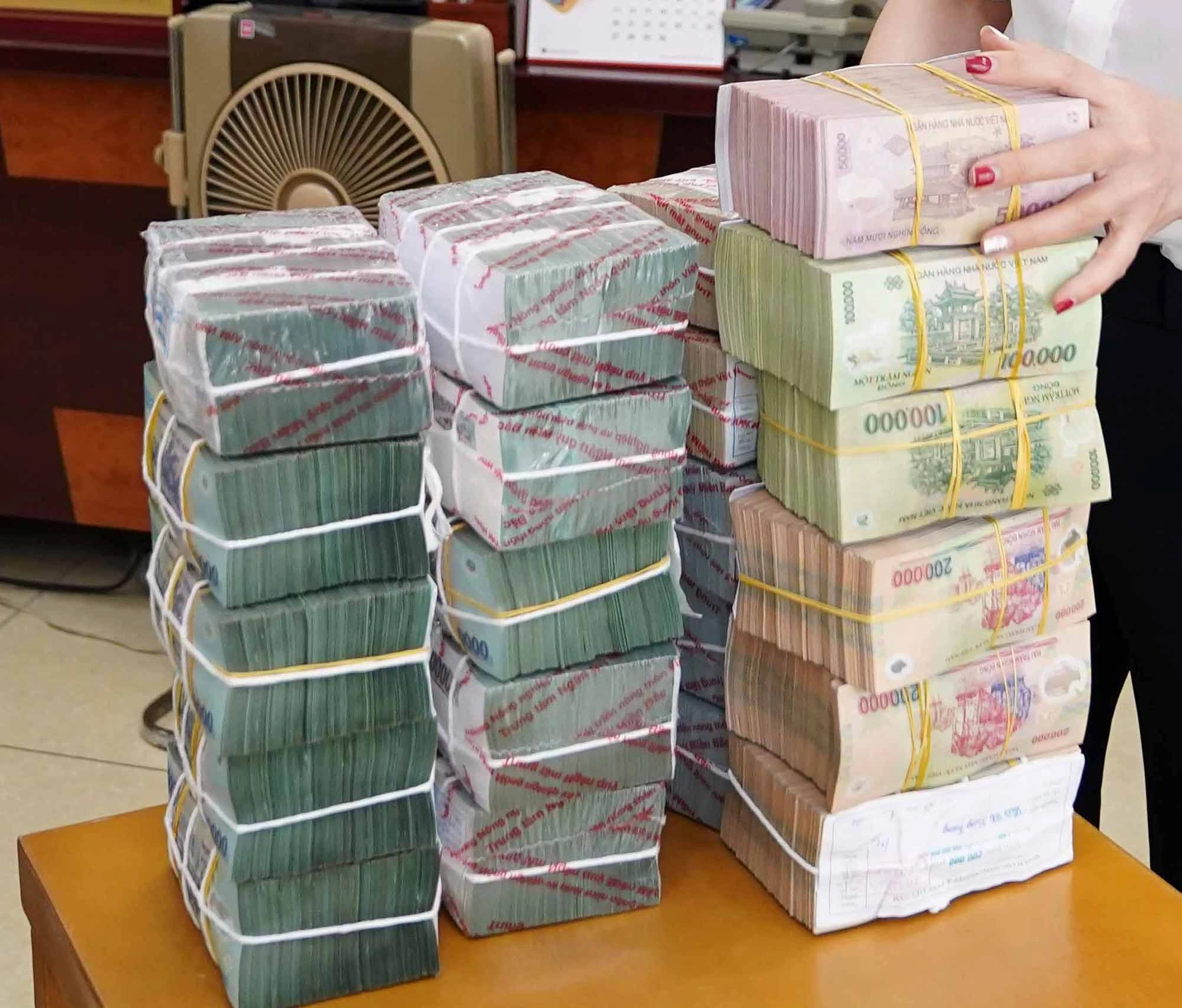 Đổi tiền mới có thể bị phạt nặng- Ảnh 1.