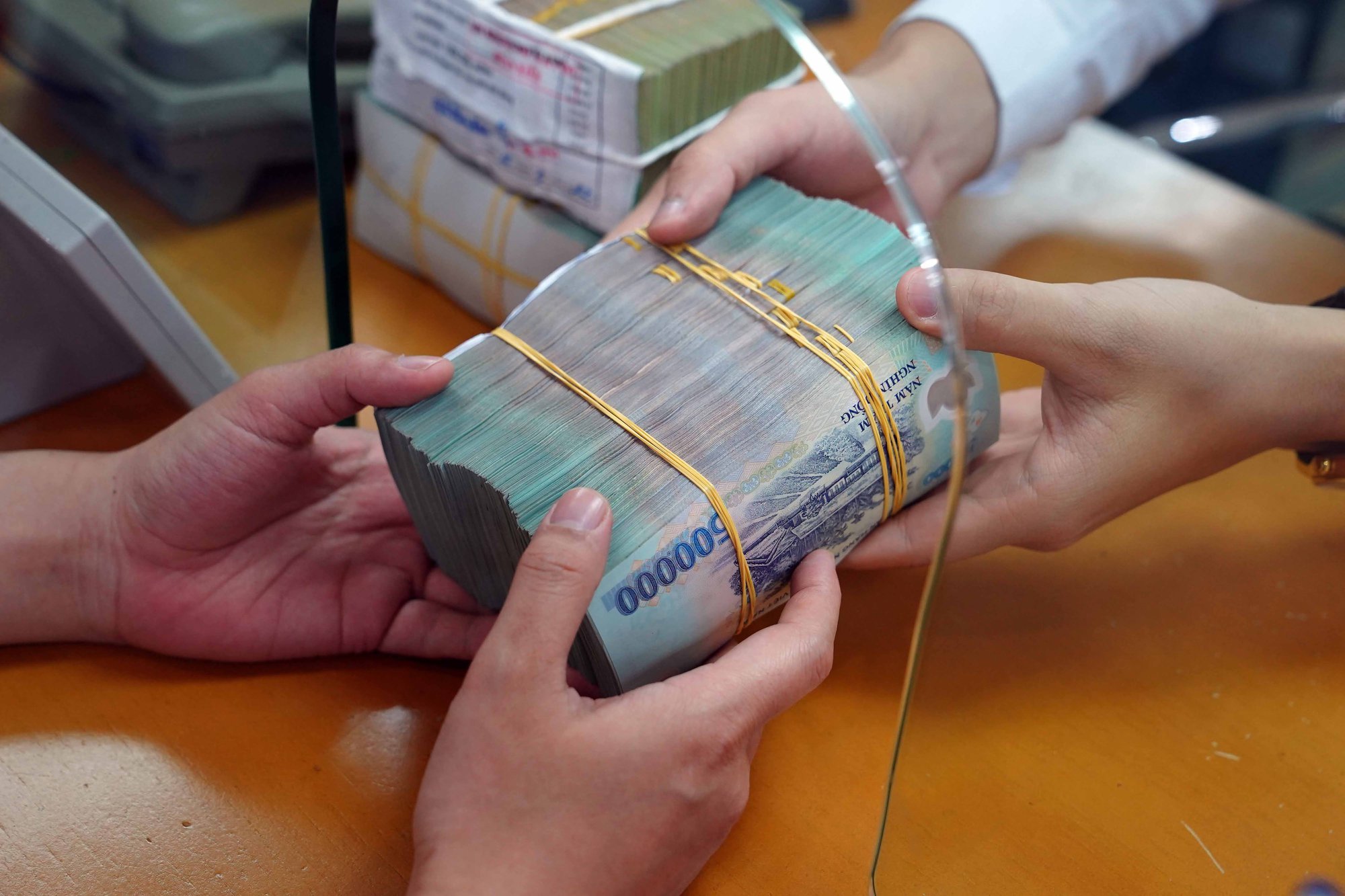 Lương tháng 12.2025 nhưng trả vào tháng 1.2026 thì tính thuế thu nhập cá nhân thế nào?- Ảnh 1.