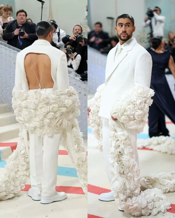 Năm 2023, với chủ đề Karl Lagerfeld: A Line of Beauty của Met Gala, rapper gây sốt khi diện bộ vest trắng hở lưng do Jacquemus thiết kế. Anh còn phối thêm khăn choàng dài chấm đất màu trắng đính hoa trà - loài hoa biểu tượng của Chanel. Ảnh: Pinterest