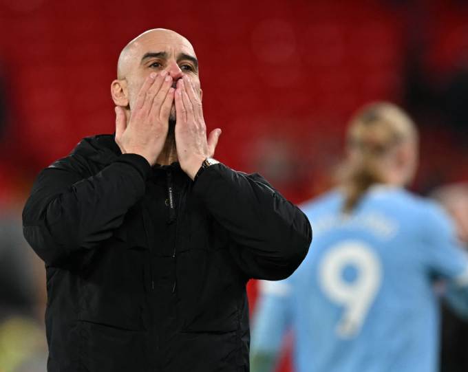 HLV Pep Guardiola vui mừng sau trận Man City thắng Liverpool 2-1 ở vòng 25 Ngoại hạng Anh trên sân Anfield, thành phố Liverpool, Vương quốc Anh tối 8/2/2026. Ảnh: AFP