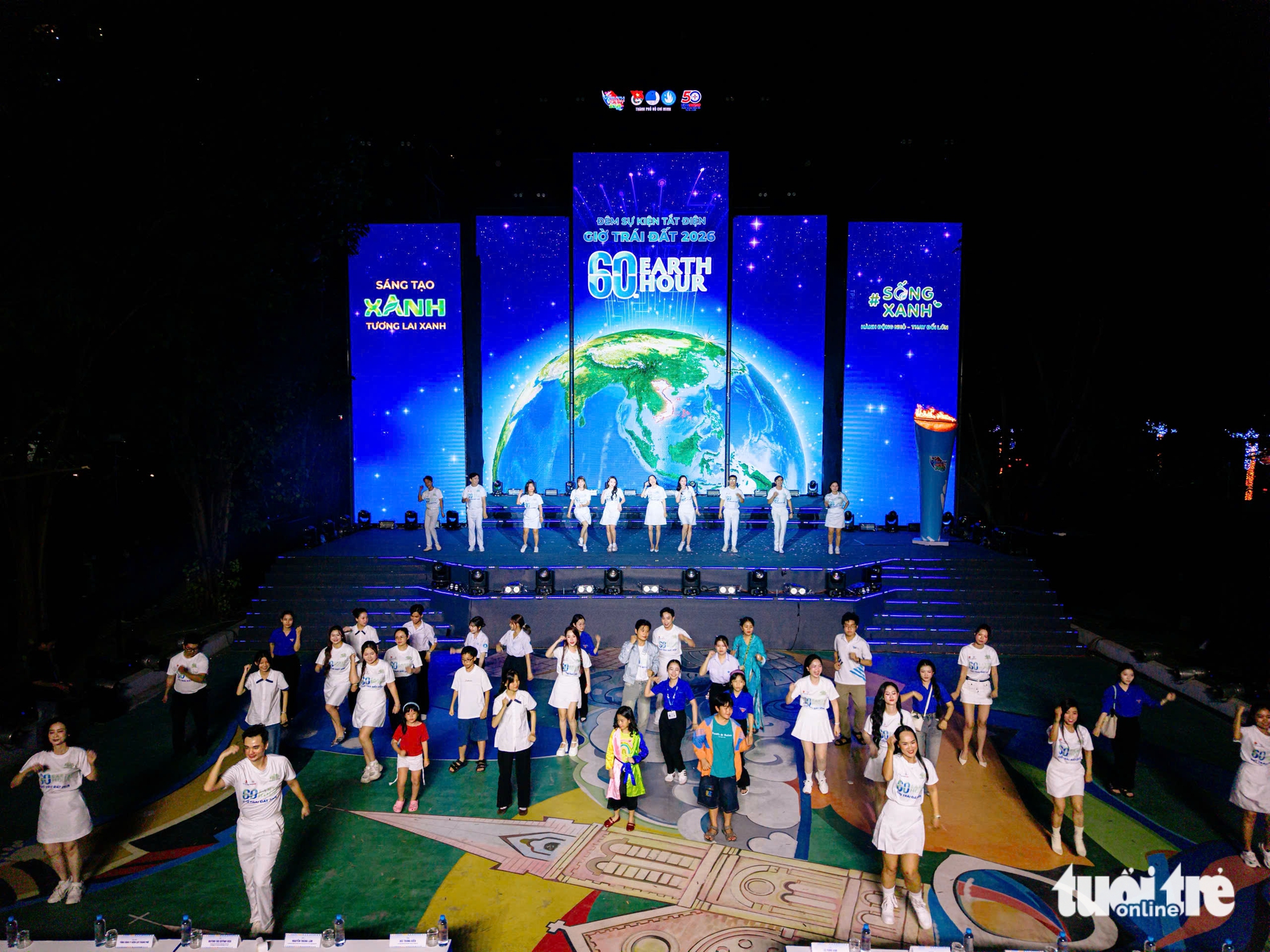 Nhạc sĩ Nguyễn Văn Chung và các nghệ sĩ cùng tuổi trẻ TP.HCM tắt đèn hưởng ứng Giờ Trái đất 2026 5 giờ trái đất - Ảnh 6.