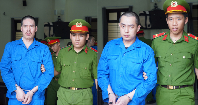 Lê Nguyên Bình và Phạm Lý Phương bị cảnh sát dẫn giải ra xe sau phiên xử. Ảnh: Hoàng Nam