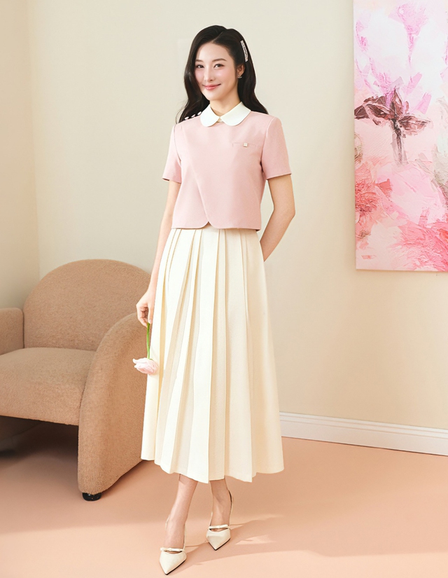 Váy xếp ly, điểm nhấn cho phong cách công sở hiện đại- Ảnh 1.